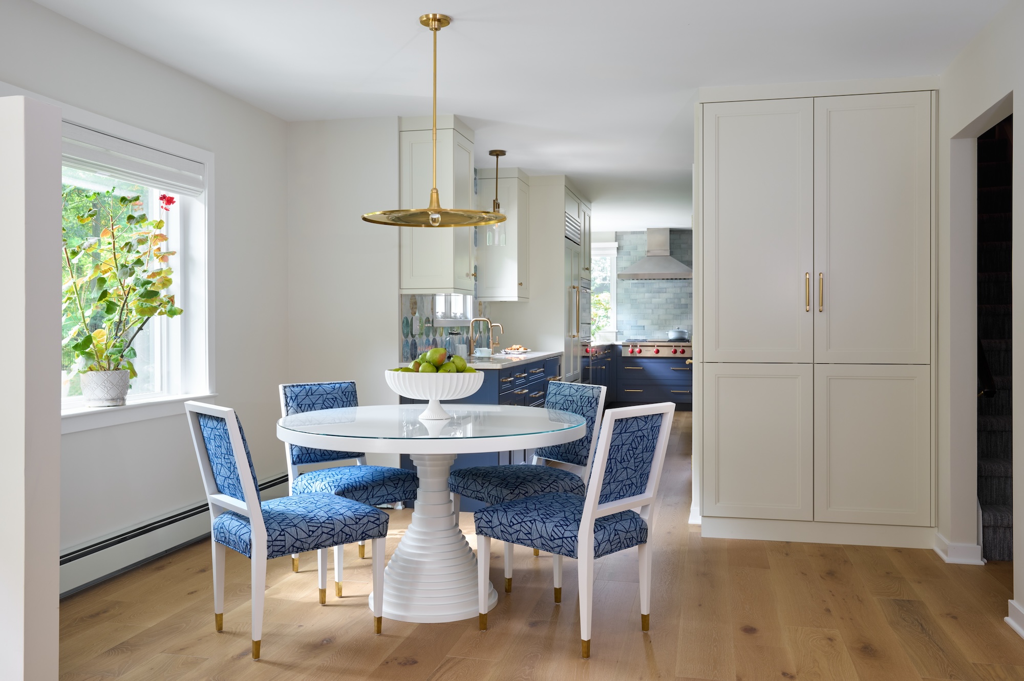 white dining table with blue chairs