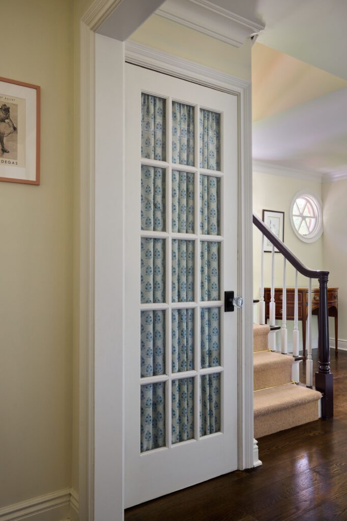 Wostbrock Home Interior Design HoHoKus NJ. Blue-and-white fabric lined French door.